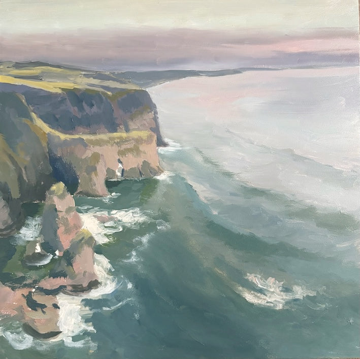 An oil painting of a dramatic coastal landscape at Magheracross featuring steep green and brown cliffs dropping into a deep teal ocean with white surf under a soft pink and gray sky. Views of Whiterocks and Portrush in the distance.